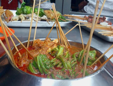 Satay Celup y experiencias culinarias locales